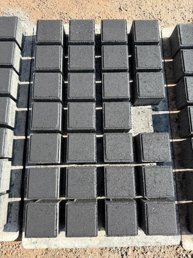 Square cobblestone pavers banded into packs at the yard