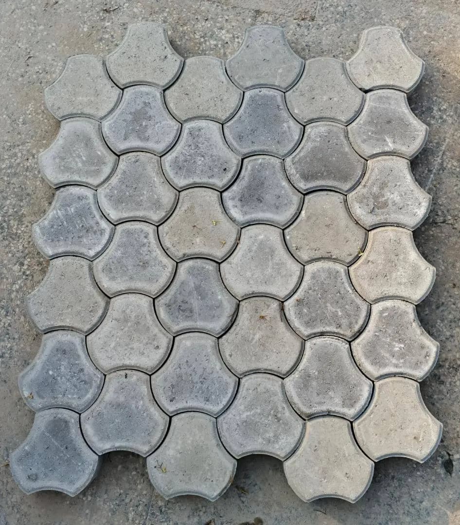 Star pavers laid in a red and grey interlocking pattern